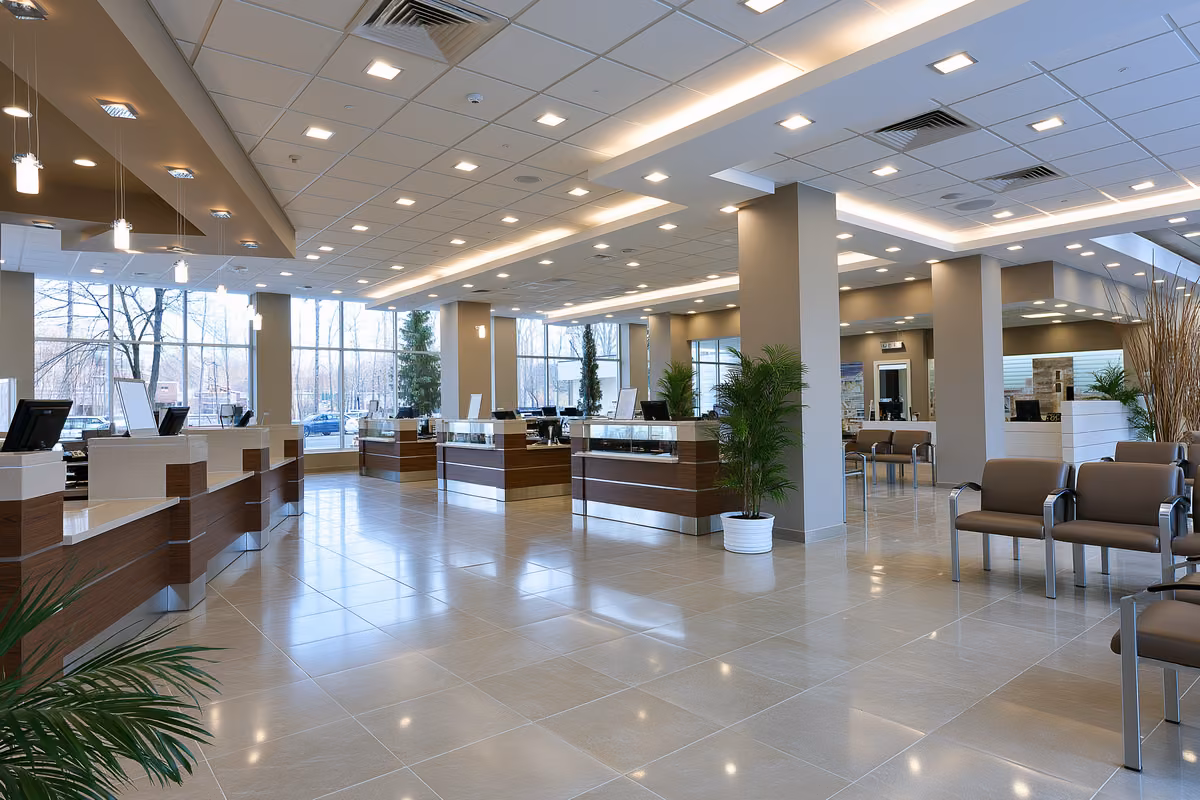 A quiet bank branch interior with empty service counters in Germany.
